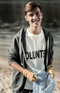 Young volunteer helping his community on Giving Tuesday 2018