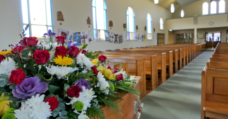 Large funeral parlor prepared for a service by funeral directors